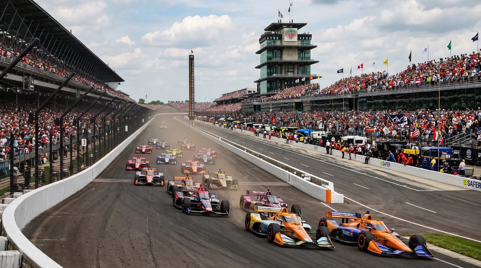 IndyCar race cars speeding at the Indianapolis Motor Speedway