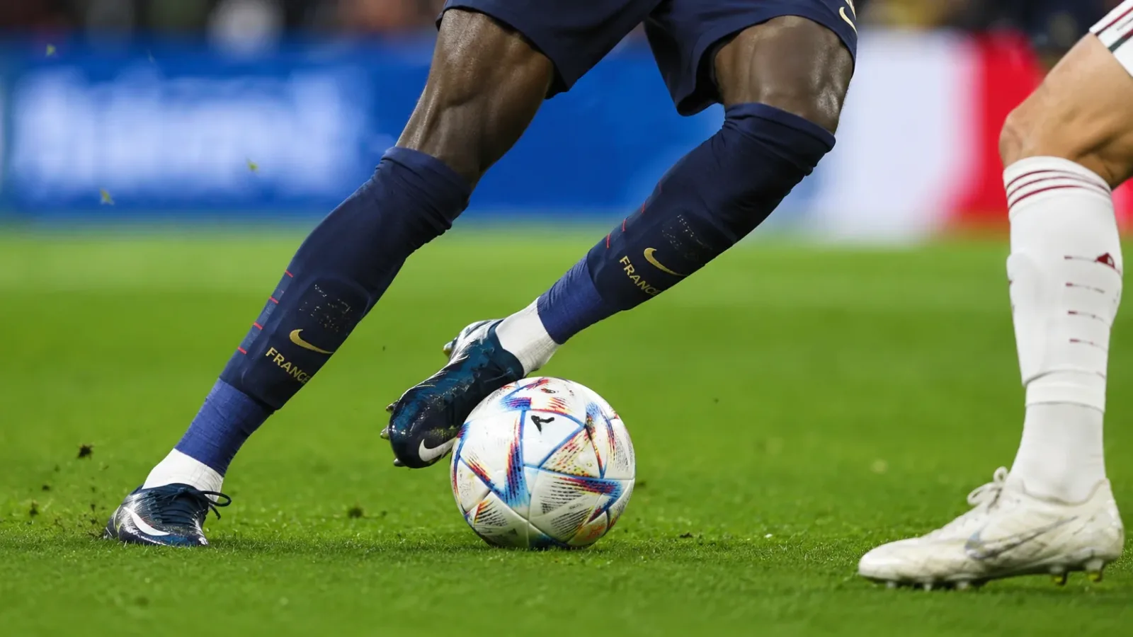 Close-up of Ousmane Dembele's feet during a match, shifting the ball between left and right foot, illustrating ambidexterity.
