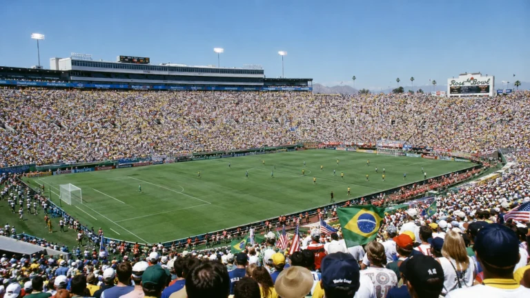 A wide-angle photograph of the packed Rose Bowl stadium during the 1994 World Cup final under bright California sunshine.